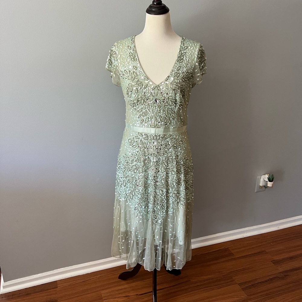 Adrianna Papell Beaded dress with cap sleeve.